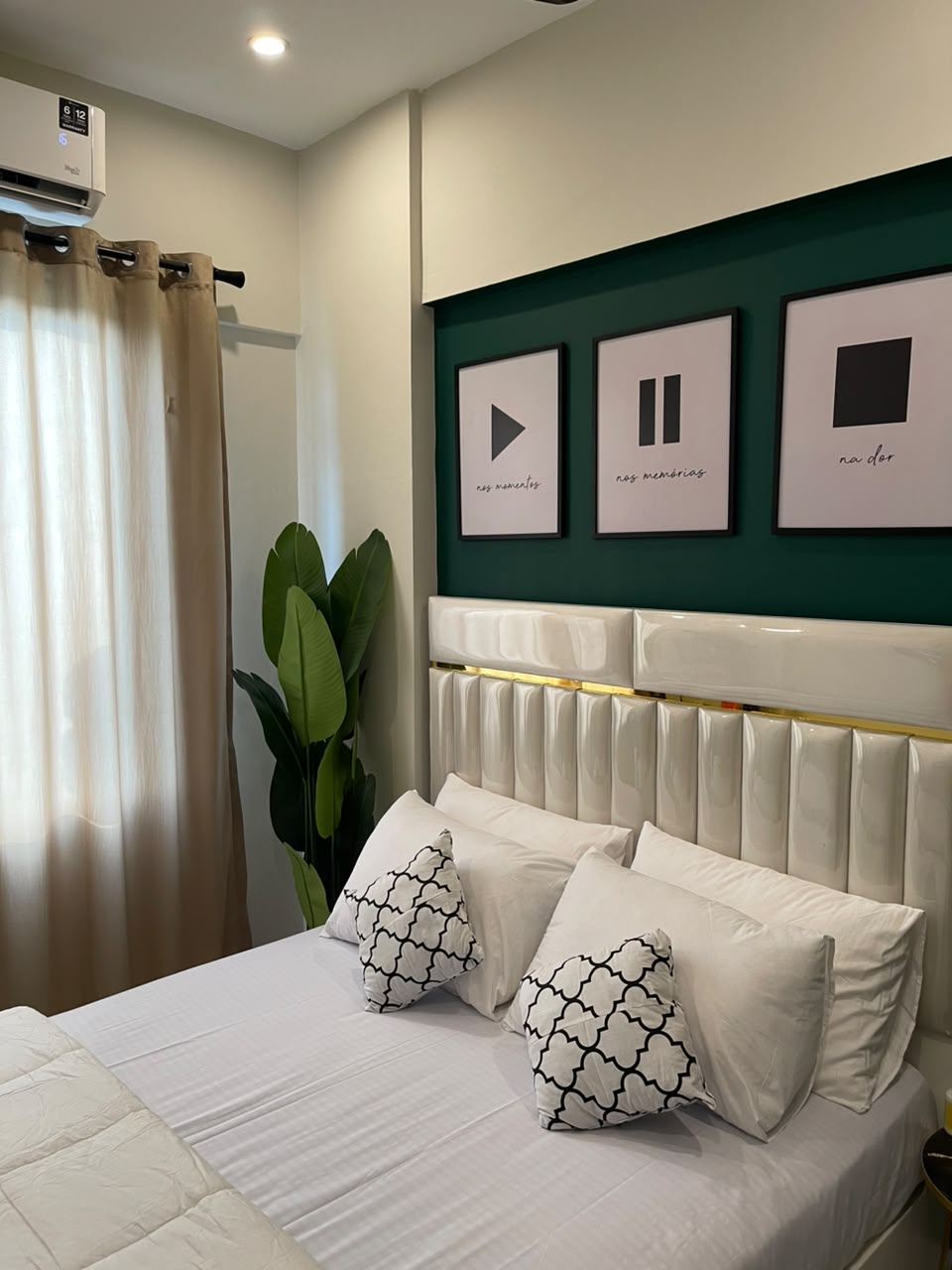 Elegant Evershine bedroom with a forest-green feature wall